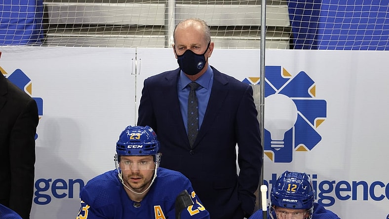 Mar 15, 2021; Buffalo, New York, USA;  Buffalo Sabres head coach Ralph Krueger watches his team play from the bench during the second period against the Washington Capitals at KeyBank Center. Mandatory Credit: Timothy T. Ludwig-USA TODAY Sports