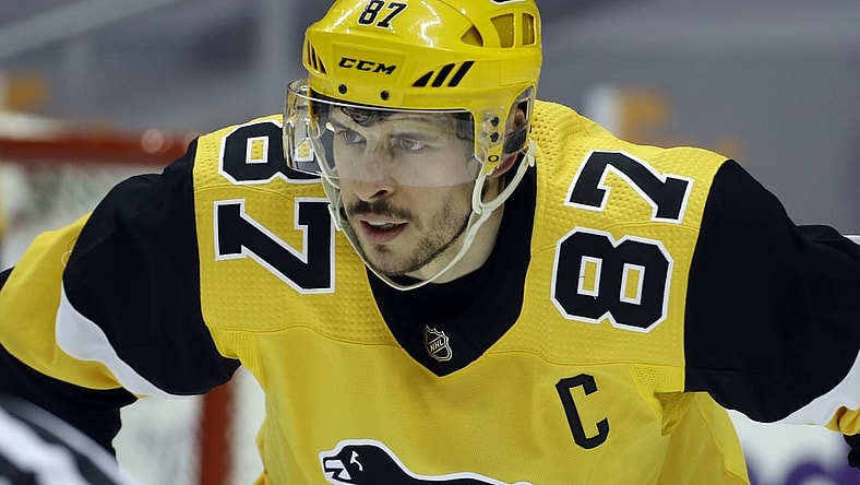 Mar 16, 2021; Pittsburgh, Pennsylvania, USA;  Pittsburgh Penguins center Sidney Crosby (87) at the face-off circle against the Boston Bruins during the second period at PPG Paints Arena. Boston won 2-1. Mandatory Credit: Charles LeClaire-USA TODAY Sports