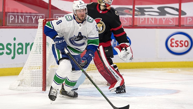 Mar 17, 2021; Ottawa, Ontario, CAN; Vancouver Canucks center J.T. Miller (9) skates away from  Ottawa Senators goalie Joey Daccord (34) following a shot on goal in the first period at the Canadian Tire Centre. Mandatory Credit: Marc DesRosiers-USA TODAY Sports