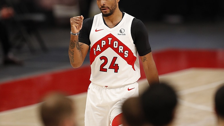 Mar 17, 2021; Detroit, Michigan, USA; Toronto Raptors guard Norman Powell (24) pumps his fist after the second quarter against the Detroit Pistons at Little Caesars Arena. Mandatory Credit: Raj Mehta-USA TODAY Sports