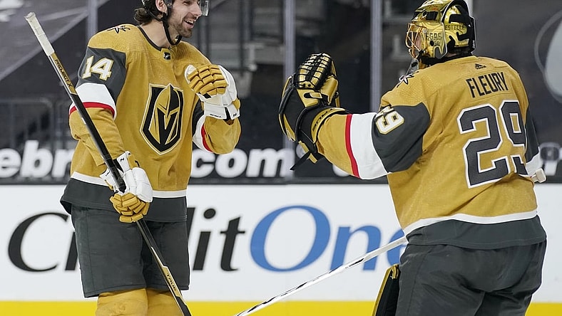 Mar 17, 2021; Las Vegas, Nevada, USA; Vegas Golden Knights goaltender Marc-Andre Fleury (right) celebrates after a goal by defenseman Nicolas Hague (14) against the San Jose Sharks during the third period at T-Mobile Arena. Mandatory Credit:  John Locher/POOL PHOTOS-USA TODAY Sports
