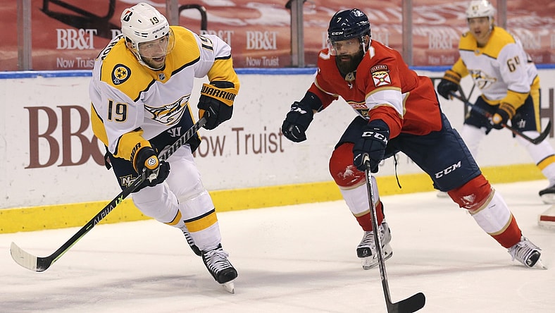 Mar 18, 2021; Sunrise, Florida, USA; Nashville Predators center Calle Jarnkrok (19) skates with the puck around Florida Panthers defenseman Radko Gudas (7) during the first period at BB&T Center. Mandatory Credit: Sam Navarro-USA TODAY Sports