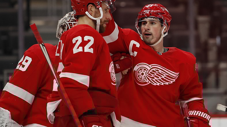 Mar 18, 2021; Detroit, Michigan, USA; Detroit Red Wings center Dylan Larkin (71) celebrates with defenseman Patrik Nemeth (22) after the game against the Dallas Stars at Little Caesars Arena. Mandatory Credit: Raj Mehta-USA TODAY Sports