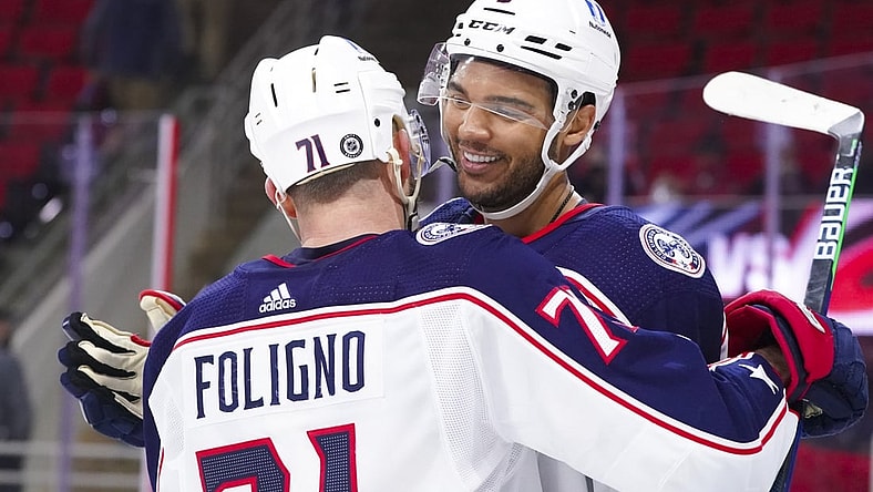 Mar 18, 2021; Raleigh, North Carolina, USA;  Columbus Blue Jackets defenseman Seth Jones (3) is congratulated by left wing Nick Foligno (71) after his game winning overtime goal against the Carolina Hurricanes at PNC Arena. Mandatory Credit: James Guillory-USA TODAY Sports