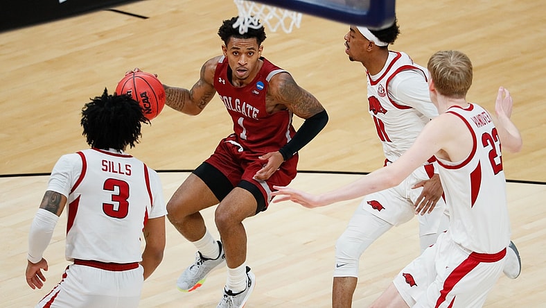 Colgate Raiders guard Jordan Burns (1) attempts to maneuver around Arkansas Razorbacks defense during the first round of the 2021 NCAA Tournament on Friday, March 19, 2021, at Bankers Life Fieldhouse in Indianapolis, Ind. Mandatory Credit: Adam Cairns/IndyStar via USA TODAY Sports