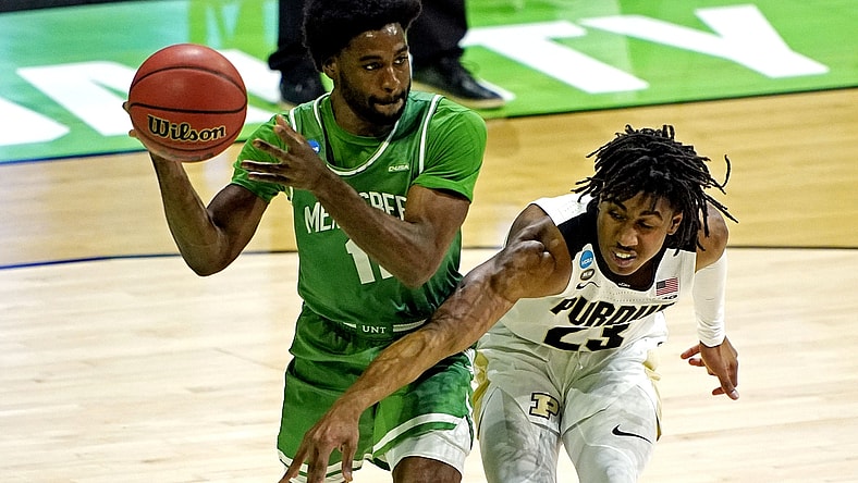 Mar 19, 2021; Indianapolis, Indiana, USA; North Texas Mean Green guard JJ Murray (11) handles the ball against Purdue Boilermakers guard Jaden Ivey (23) during the first half in the first round of the 2021 NCAA Tournament at Lucas Oil Stadium. Mandatory Credit: Andrew Nelles-USA TODAY Sports