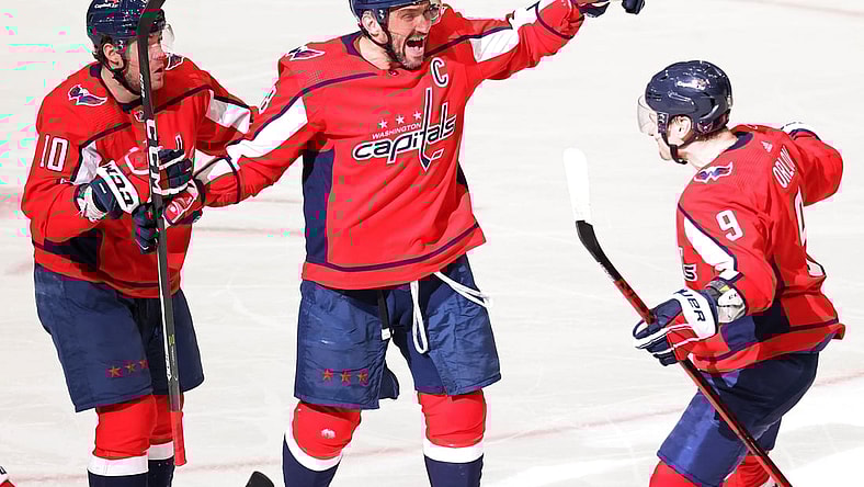 Mar 19, 2021; Washington, District of Columbia, USA;Washington Capitals left wing Alex Ovechkin (8) celebrates with Capitals defenseman Dmitry Orlov (9) and Capitals right wing Daniel Sprong (10) after scoring the go ahead goal against the New York Rangers in the third period at Capital One Arena. Mandatory Credit: Geoff Burke-USA TODAY Sports