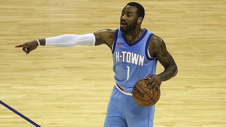 Mar 19, 2021; Houston, Texas, USA; Houston Rockets guard John Wall (1) controls the ball during the third quarter against the Detroit Pistons at Toyota Center. Mandatory Credit: Troy Taormina-USA TODAY Sports