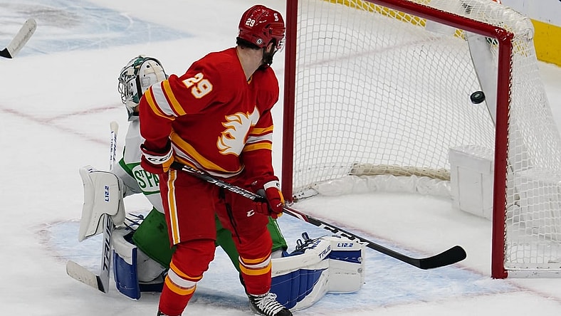 Mar 19, 2021; Toronto, Ontario, CAN; Calgary Flames forward Dillon Dube (29) watches a shot by Calgary Flames defenseman Christopher Tanev (not pictured) score on Toronto Maple Leafs goaltender Frederik Andersen (31) during the first period at Scotiabank Arena. Mandatory Credit: John E. Sokolowski-USA TODAY Sports