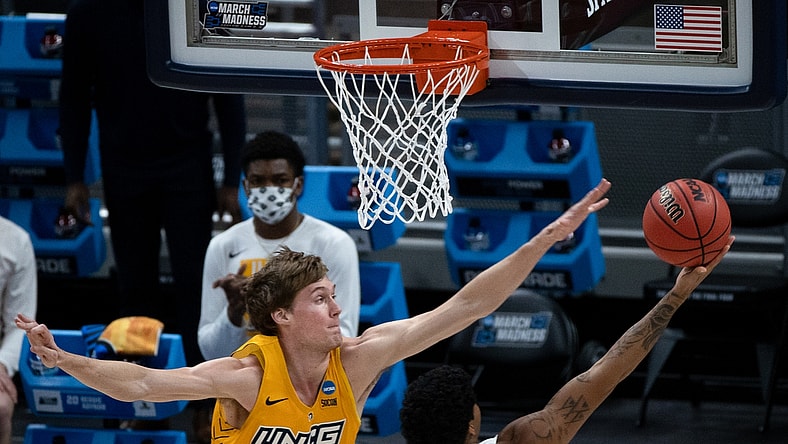 UNC Greensboro center Hayden Koval (25) attempts to block Florida State guard Rayquan Evans (0) during the first round of the 2021 NCAA Tournament on Saturday, March 20, 2021, at Bankers Life Fieldhouse in Indianapolis, Ind. Mandatory Credit: Albert Cesare/IndyStar via USA TODAY Sports