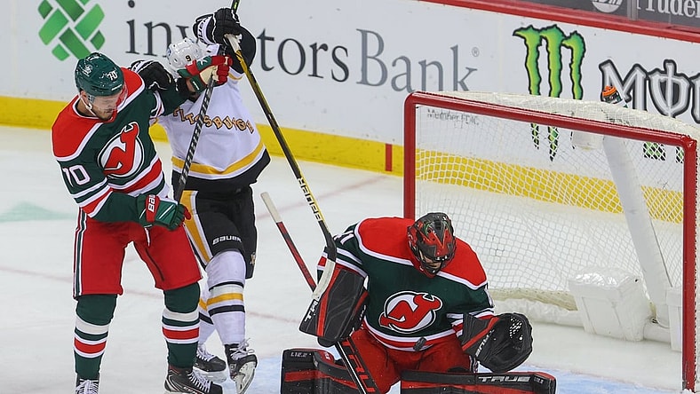 Mar 20, 2021; Newark, New Jersey, USA; New Jersey Devils goaltender Scott Wedgewood (41) makes a save during the first period of their game against the Pittsburgh Penguins at Prudential Center. Mandatory Credit: Ed Mulholland-USA TODAY Sports