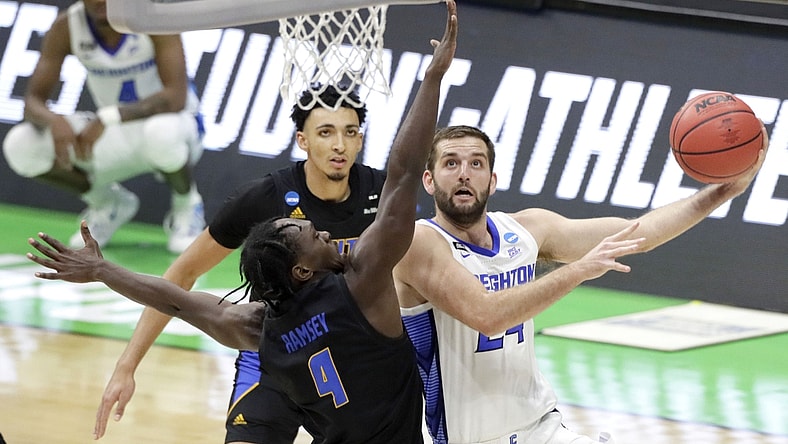 Creighton Bluejays guard Mitch Ballock (24) goes up for a shot while being guarded by UC Santa Barbara Gauchos guard Devearl Ramsey (4) during the first round of the 2021 NCAA Tournament on Saturday, March 20, 2021, at Lucas Oil Stadium in Indianapolis, Ind. Mandatory Credit: Barbara Perenic/IndyStar via USA TODAY Sports