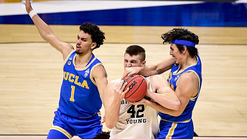 Mar 20, 2021; Indianapolis, IN, USA; Brigham Young Cougars center Richard Harward (42) and UCLA Bruins guard Jaime Jaquez Jr. (4) fight for the rebound iduring the first round of the 2021 NCAA Tournament at Hinkle Fieldhouse.  Mandatory Credit: Marc Lebryk-USA TODAY Sports