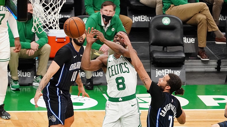 Mar 21, 2021; Boston, Massachusetts, USA; Boston Celtics guard Kemba Walker (8) is fouled by Orlando Magic guard Michael Carter-Williams (7) in the third quarter at TD Garden. Mandatory Credit: David Butler II-USA TODAY Sports