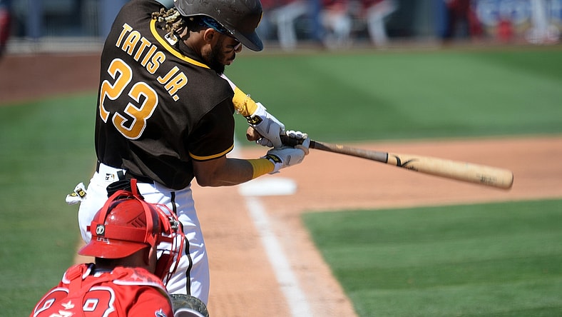 Mar 21, 2021; Peoria, Arizona, USA; San Diego Padres shortstop Fernando Tatis Jr. (23) bats against the Los Angeles Angels during the third inning of a spring training game at Peoria Sports Complex. Mandatory Credit: Joe Camporeale-USA TODAY Sports