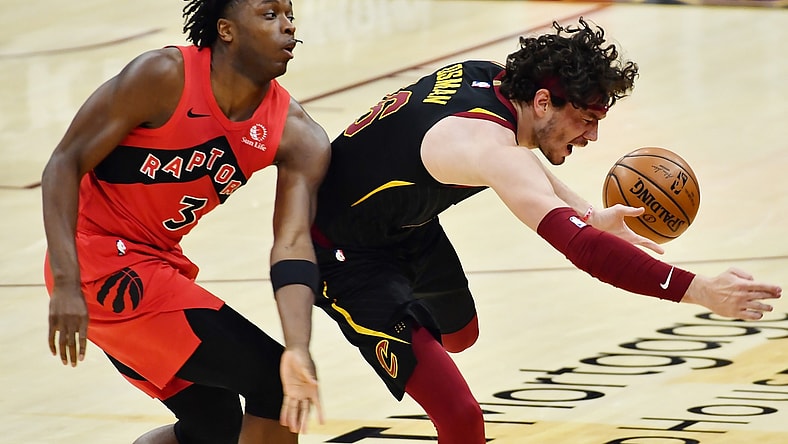 Mar 21, 2021; Cleveland, Ohio, USA; Toronto Raptors forward OG Anunoby (3) and Cleveland Cavaliers forward Cedi Osman (16) go for a loose ball during the second quarter at Rocket Mortgage FieldHouse. Mandatory Credit: Ken Blaze-USA TODAY Sports