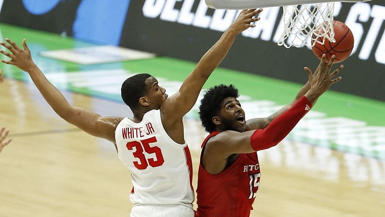 Mar 21, 2021; Indianapolis, Indiana, USA; Rutgers Scarlet Knights center Myles Johnson (15) goes up for a shot while Houston Cougars forward Fabian White Jr. (35) defends during the second half in the second round of the 2021 NCAA Tournament at Lucas Oil Stadium. Mandatory Credit: Joshua Bickel-USA TODAY Sports