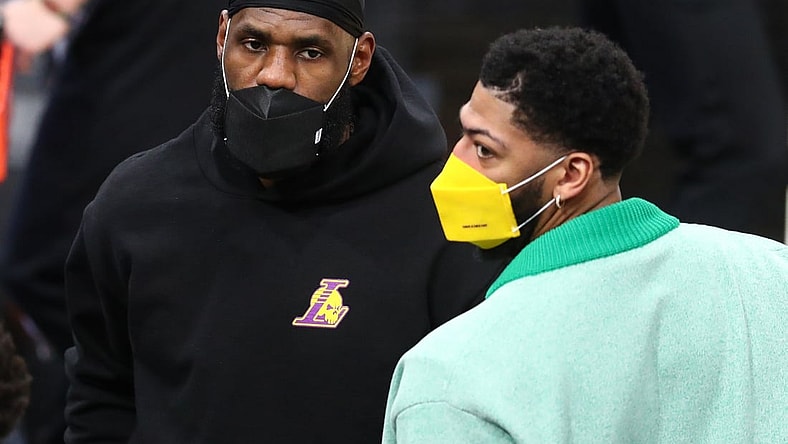 Mar 21, 2021; Phoenix, Arizona, USA; Los Angeles Lakers injured forward LeBron James (left) and Anthony Davis against the Phoenix Suns during the first half at Phoenix Suns Arena. Mandatory Credit: Mark J. Rebilas-USA TODAY Sports