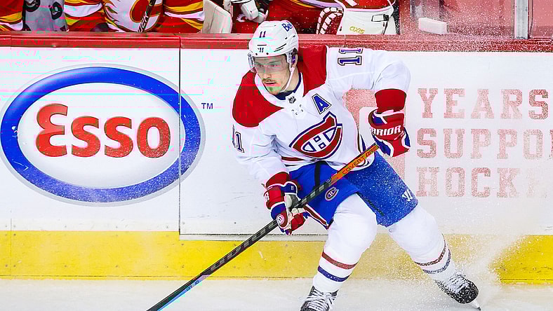 Mar 13, 2021; Calgary, Alberta, CAN; Montreal Canadiens right wing Brendan Gallagher (11) controls the puck against the Calgary Flames during the first period at Scotiabank Saddledome. Mandatory Credit: Sergei Belski-USA TODAY Sports