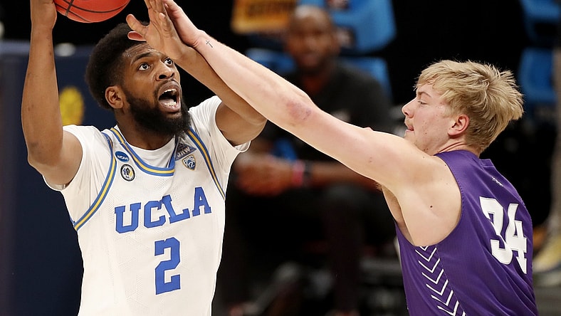 UCLA Bruins forward Cody Riley (2) is fouled by Abilene Christian Wildcats center Kolton Kohl (34) during the second round of the 2021 NCAA Tournament on Monday, March 22, 2021, at Bankers Life Fieldhouse in Indianapolis, Ind. Mandatory Credit: Michael Caterina/IndyStar via USA TODAY Sports