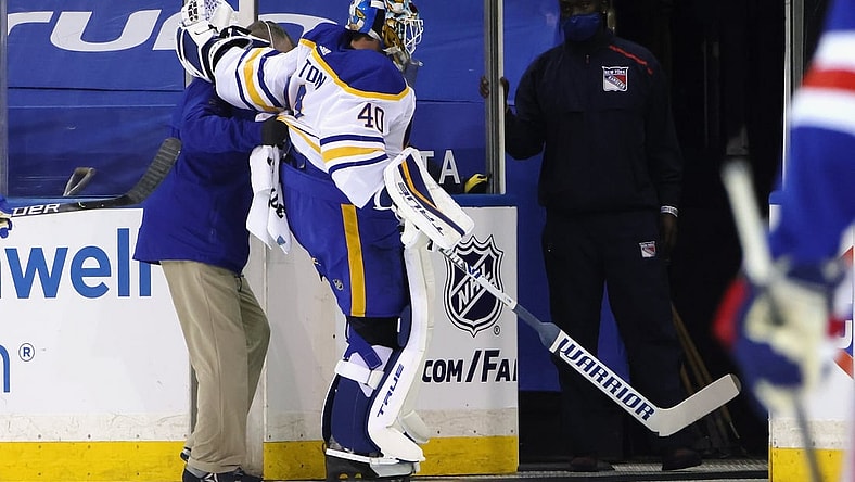 Mar 22, 2021; New York, New York, USA;  Buffalo Sabres goaltender Carter Hutton (40)  is assisted off the ice following a first period injury against the New York Rangers at Madison Square Garden. Mandatory Credit: Bruce Bennett/POOL PHOTOS-USA TODAY Sports