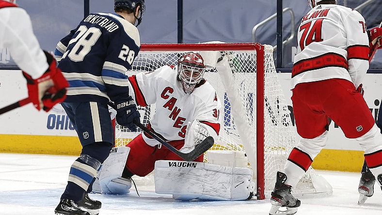 Mar 25, 2021; Columbus, Ohio, USA; Carolina Hurricanes goalie Alex Nedeljkovic (39) makes a save on a Columbus Blue Jackets center Boone Jenner (38) shot attempt during the first period at Nationwide Arena. Mandatory Credit: Russell LaBounty-USA TODAY Sports