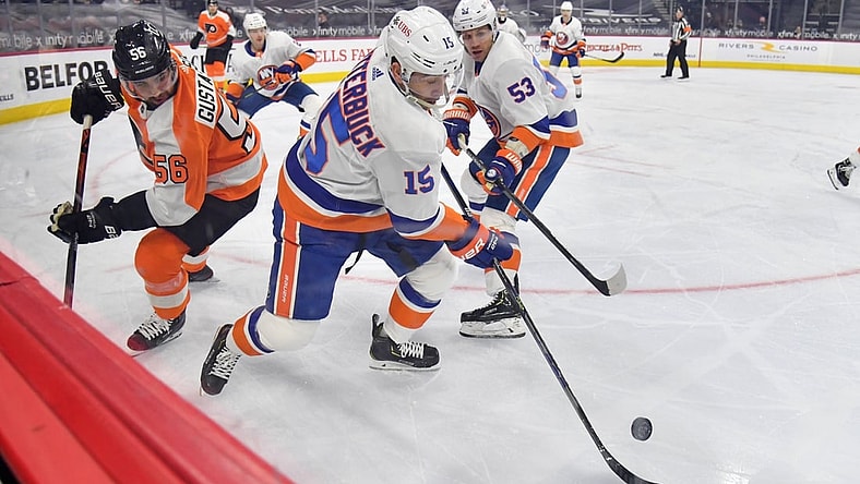Mar 22, 2021; Philadelphia, Pennsylvania, USA; New York Islanders right wing Cal Clutterbuck (15) skates away from Philadelphia Flyers defenseman Erik Gustafsson (56) during the first period at Wells Fargo Center. Mandatory Credit: Eric Hartline-USA TODAY Sports