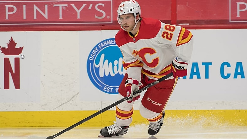 Mar 22, 2021; Ottawa, Ontario, CAN; Calgary Flames center Elias Lindholm (28) skates with the puck in the second period against the Ottawa Senators at the Canadian Tire Centre. Mandatory Credit: Marc DesRosiers-USA TODAY Sports