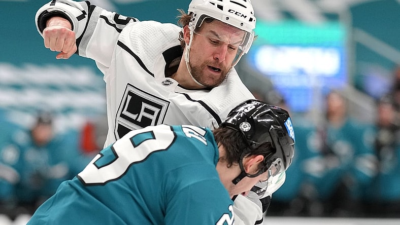 Mar 22, 2021; San Jose, California, USA;  Los Angeles Kings defenseman Kurtis MacDermid (56) fights against San Jose Sharks right wing Kurtis Gabriel (29) during the first period at SAP Center at San Jose. Mandatory Credit: Stan Szeto-USA TODAY Sports