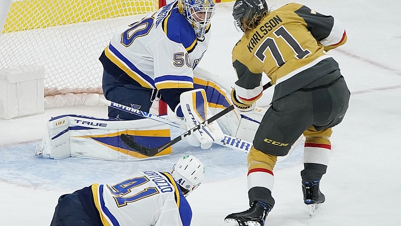 Mar 22, 2021; Las Vegas, Nevada, USA; Vegas Golden Knights center William Karlsson (71) scores against St. Louis Blues goaltender Jordan Binnington (50) during the third period at T-Mobile Arena. Mandatory Credit: John Locher /POOL PHOTOS-USA TODAY Sports