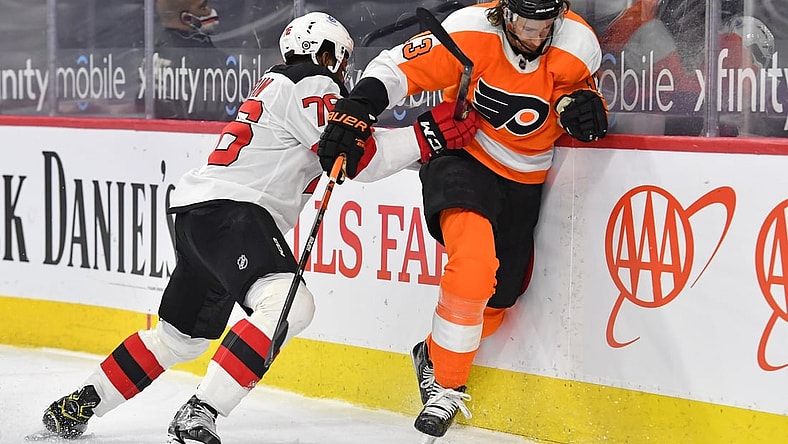 Mar 23, 2021; Philadelphia, Pennsylvania, USA; New Jersey Devils defenseman P.K. Subban (76) checks Philadelphia Flyers center Kevin Hayes (13) during the first period at Wells Fargo Center. Mandatory Credit: Eric Hartline-USA TODAY Sports