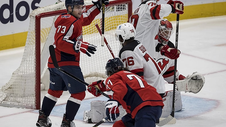 Mar 25, 2021; Washington, District of Columbia, USA; Washington Capitals left wing Conor Sheary (73) celebrates after defenseman Dmitry Orlov (9) not pictured scores a goal against the New Jersey Devils during the first period at Capital One Arena. Mandatory Credit: Scott Taetsch-USA TODAY Sports
