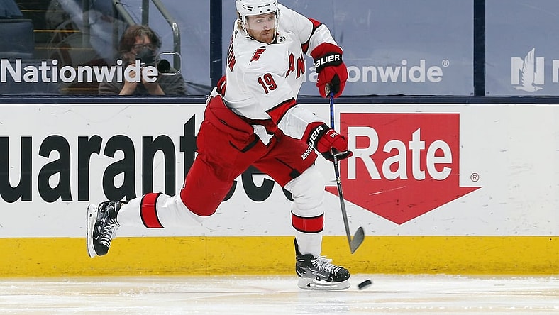 Mar 25, 2021; Columbus, Ohio, USA; Carolina Hurricanes defenseman Dougie Hamilton (19) shoots on goal against the Columbus Blue Jackets during the second period at Nationwide Arena. Mandatory Credit: Russell LaBounty-USA TODAY Sports