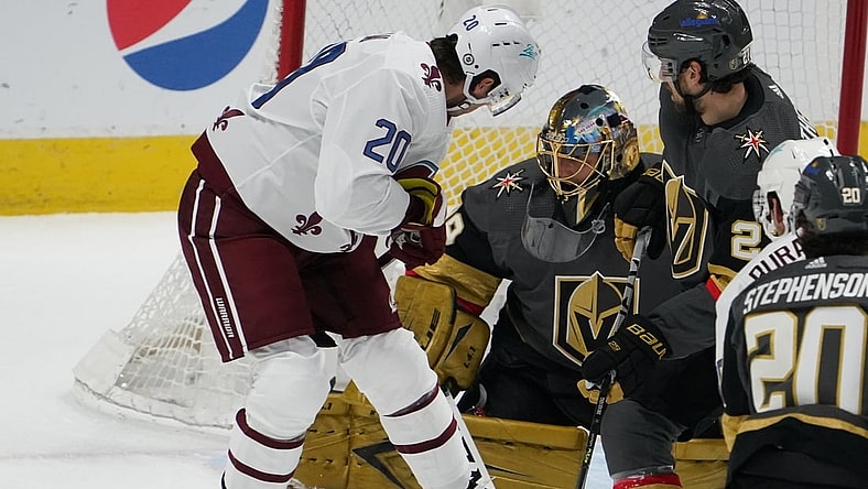 Mar 25, 2021; Denver, Colorado, USA; Colorado Avalanche left wing Brandon Saad (20) attempts a shot past Vegas Golden Knights goaltender Marc-Andre Fleury (29) in the first period at Ball Arena. Mandatory Credit: Ron Chenoy-USA TODAY Sports