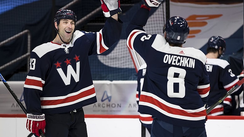 Mar 26, 2021; Washington, District of Columbia, USA; Washington Capitals defenseman Zdeno Chara (33) celebrates with left wing Alex Ovechkin (8) after the game against the New Jersey Devils at Capital One Arena. Mandatory Credit: Scott Taetsch-USA TODAY Sports