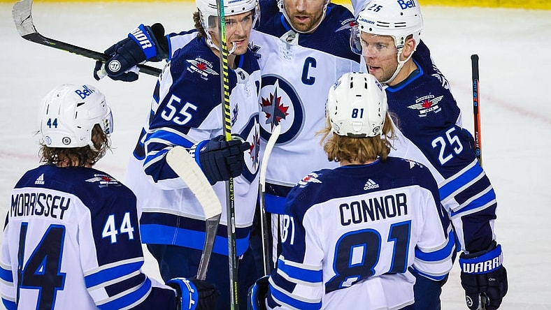 Mar 26, 2021; Calgary, Alberta, CAN; Winnipeg Jets center Paul Stastny (25) celebrates his goal with his teammates against the Calgary Flames during the third period at Scotiabank Saddledome. Mandatory Credit: Sergei Belski-USA TODAY Sports