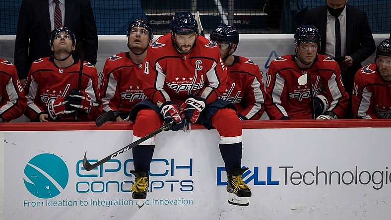 Mar 25, 2021; Washington, District of Columbia, USA; Washington Capitals left wing Alex Ovechkin (8) sits on the boards during a break in the first period of the game against the New Jersey Devils at Capital One Arena. Mandatory Credit: Scott Taetsch-USA TODAY Sports