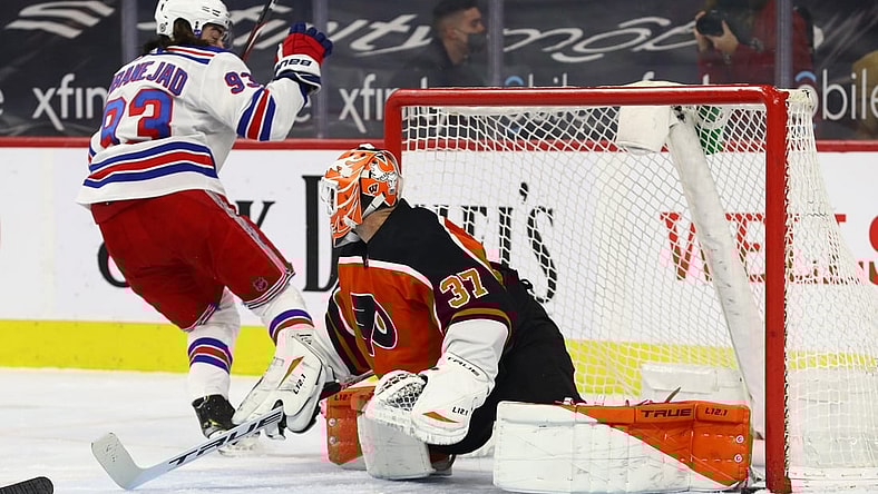 Mar 27, 2021; Philadelphia, Pennsylvania, USA; New York Rangers center Mika Zibanejad (93) scores a goal on Philadelphia Flyers goalie Brian Elliott (37) in the first period  at Wells Fargo Center. Mandatory Credit: Kyle Ross-USA TODAY Sports