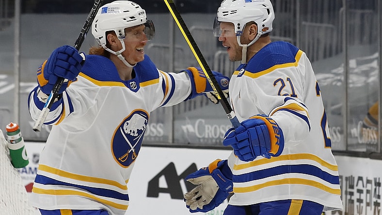 Mar 27, 2021; Boston, Massachusetts, USA; Buffalo Sabres right wing Kyle Okposo (21) celebrates his goal with center Cody Eakin (20) during the second period against the Boston Bruins at TD Garden. Mandatory Credit: Winslow Townson-USA TODAY Sports
