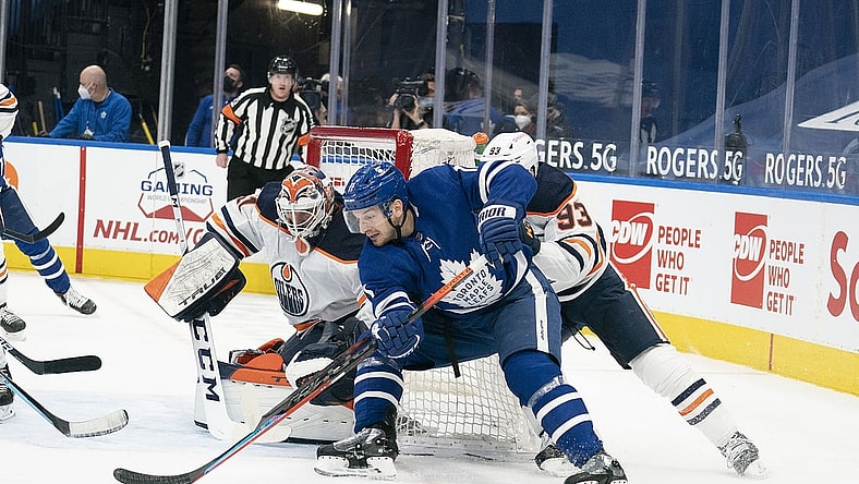 Mar 27, 2021; Toronto, Ontario, CAN; Toronto Maple Leafs left wing Zach Hyman (11) moves in for a shot on goal ahead of Edmonton Oilers center Ryan Nugent-Hopkins (93) during the first period at Scotiabank Arena. Mandatory Credit: Nick Turchiaro-USA TODAY Sports