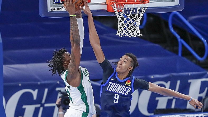Mar 27, 2021; Oklahoma City, Oklahoma, USA; Oklahoma City Thunder center Moses Brown (9) blocks a shot by Boston Celtics center Robert Williams III (44) during the second half at Chesapeake Energy Arena. Mandatory Credit: Alonzo Adams-USA TODAY Sports