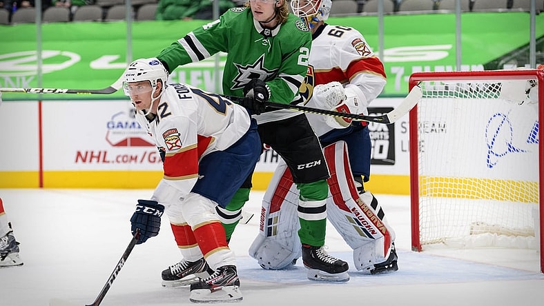 Mar 28, 2021; Dallas, Texas, USA; Florida Panthers goaltender Chris Driedger (60) and defenseman Gustav Forsling (42) defend against Dallas Stars left wing Roope Hintz (24) during the second period at the American Airlines Center. Mandatory Credit: Jerome Miron-USA TODAY Sports