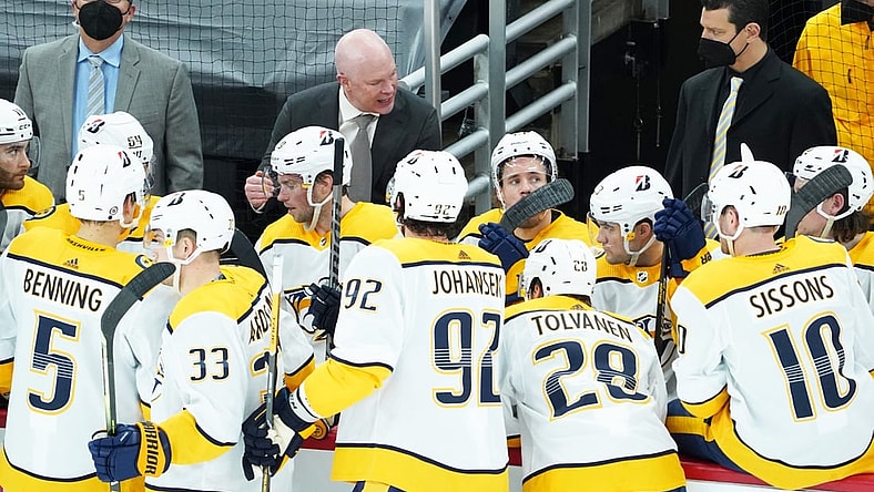 Mar 28, 2021; Chicago, Illinois, USA; Nashville Predators head coach John Hynes talks with his team during the third period at United Center. Mandatory Credit: David Banks-USA TODAY Sports