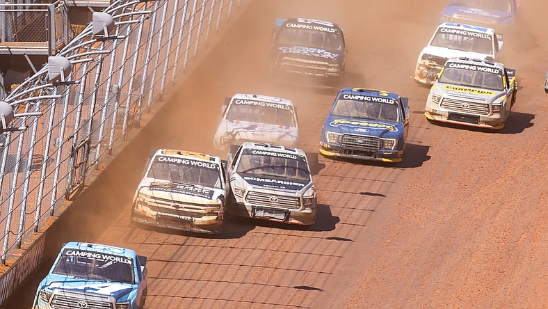 Mar 29, 2021; Bristol, TN, USA; NASCAR Gander RV and Outdoors Truck Series driver Martin Truex Jr. (51) leads a pack of cars at Bristol Motor Speedway. Mandatory Credit: Randy Sartin-USA TODAY Sports