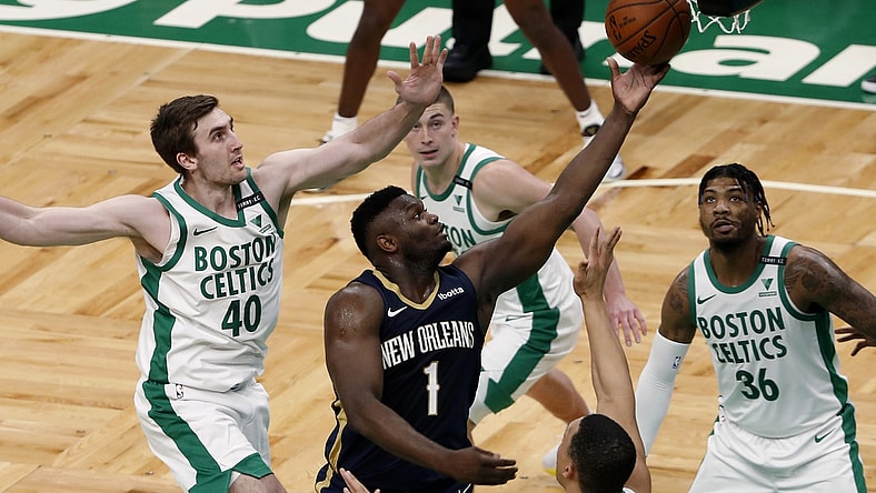 Mar 29, 2021; Boston, Massachusetts, USA; New Orleans Pelicans forward Zion Williamson (1) goes to the basket as Boston Celtics center Luke Kornet (40) and guard Marcus Smart (36) look on during the second quarter at TD Garden. Mandatory Credit: Winslow Townson-USA TODAY Sports