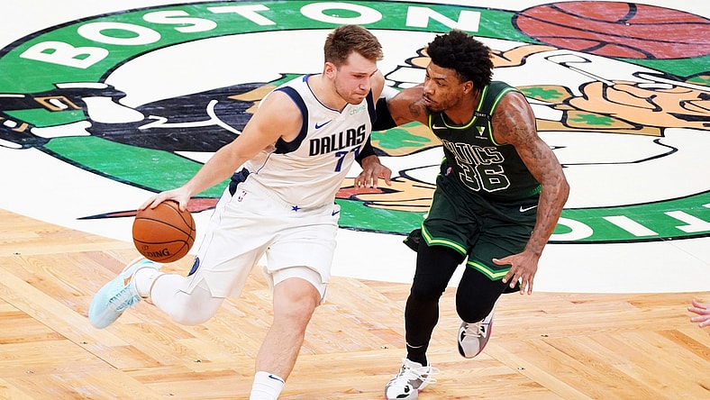 Mar 31, 2021; Boston, Massachusetts, USA; Dallas Mavericks guard Luka Doncic (77) drives the ball against Boston Celtics guard Marcus Smart (36) during the second quarter at TD Garden. Mandatory Credit: David Butler II-USA TODAY Sports