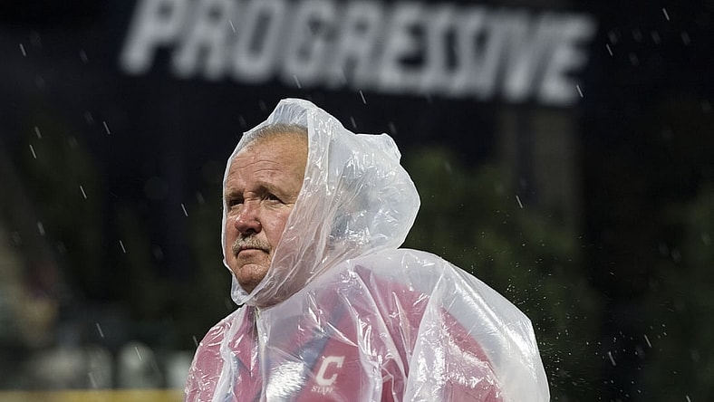 Sep 13, 2019; Cleveland, OH, USA; A Cleveland Indians employee stands on the field during a rain delay in the third inning  of the game between the Cleveland Indians and the Minnesota Twins at Progressive Field. Mandatory Credit: Ken Blaze-USA TODAY Sports