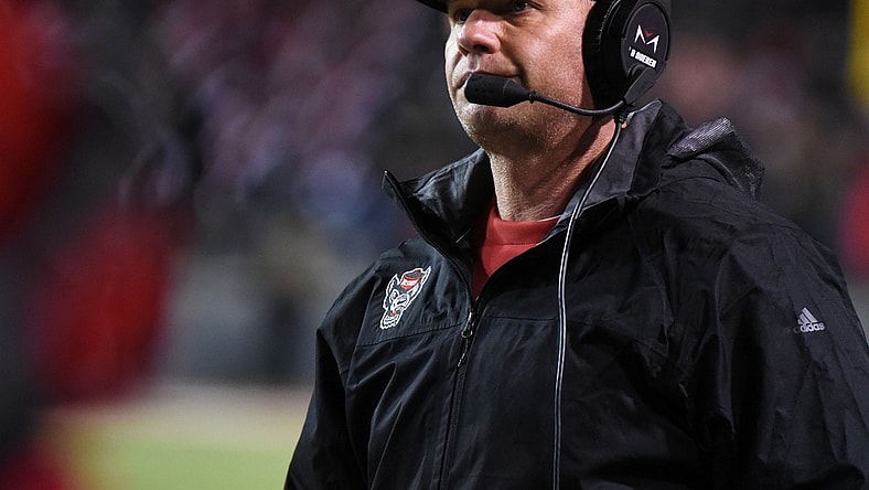 Nov 16, 2019; Raleigh, NC, USA; North Carolina State Wolfpack head coach Dave Doeren watches a replay during the second half against the Louisville Cardinals at Carter-Finley Stadium. Mandatory Credit: Rob Kinnan-USA TODAY Sports
