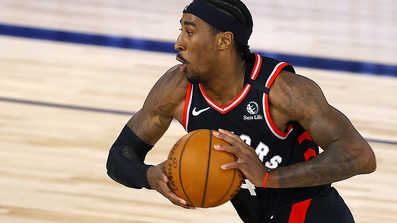Aug 10, 2020; Lake Buena Vista, Florida, USA; Rondae Hollis-Jefferson #4 of the Toronto Raptors drives against the Milwaukee Bucks during the second quarter at The Field House at ESPN Wide World Of Sports Complex on August 10, 2020 in Lake Buena Vista, Florida. Mandatory Credit: Mike Ehrmann/Pool Photo-USA TODAY Sports