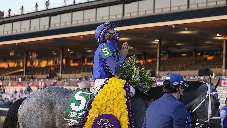 Nov 6, 2020; Lexington, KY, USA; Luis Saez aboard Essential Quality (5) reacts after winning the Breeder's Cup Juvenile race during the 37th Breeders Cup World Championship at Keeneland Race Track. Mandatory Credit: Katie Stratman-USA TODAY Sports